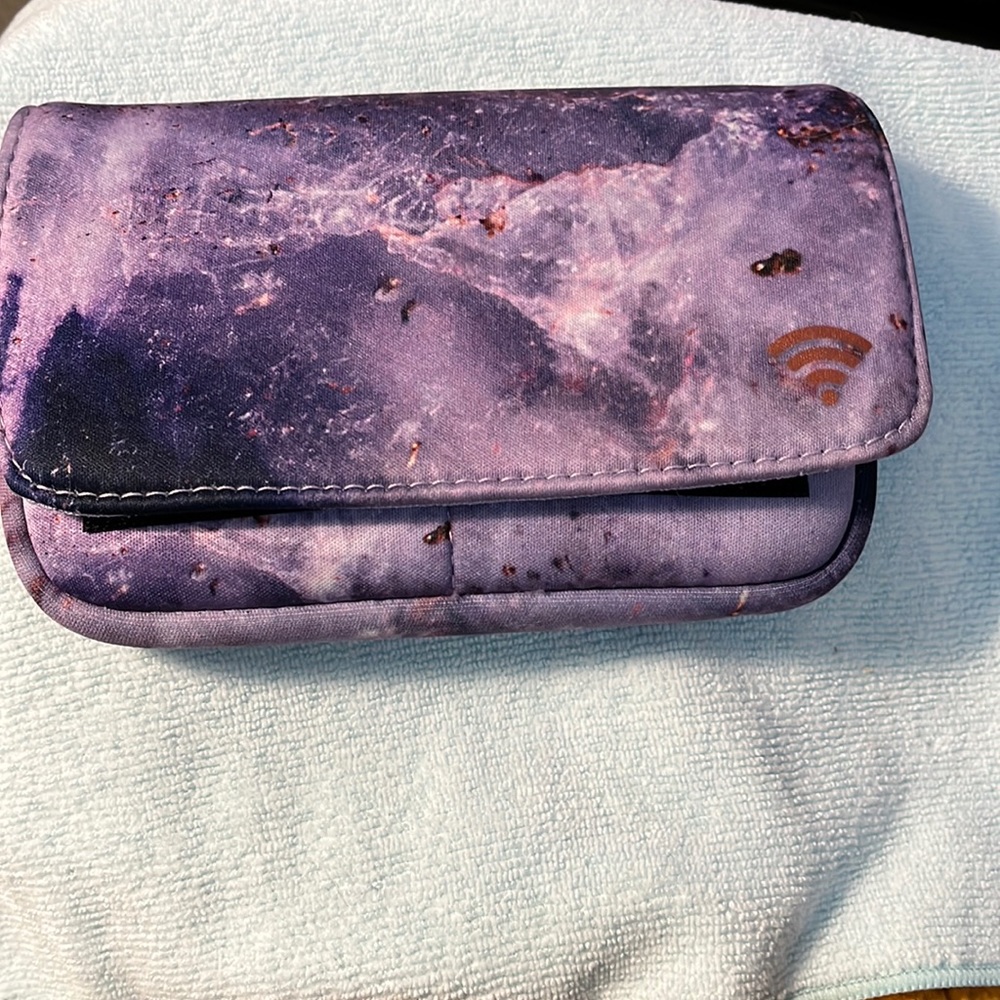 Tech case accessory.  purple marble pattern. soft neoprene. Like new